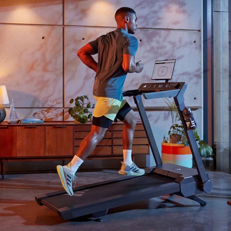 Adidas T-24c Folding Treadmill with Man Running While Inclined