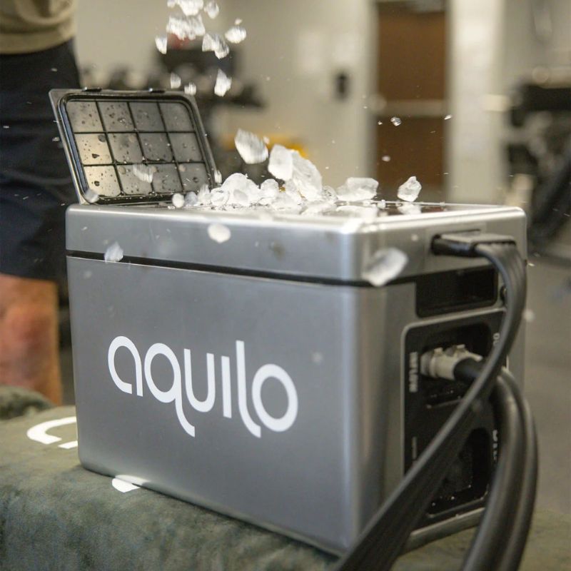 AquiloSportCCT1500CompressionBootsControlUnitLookOutdoorwithMalePuttingIce