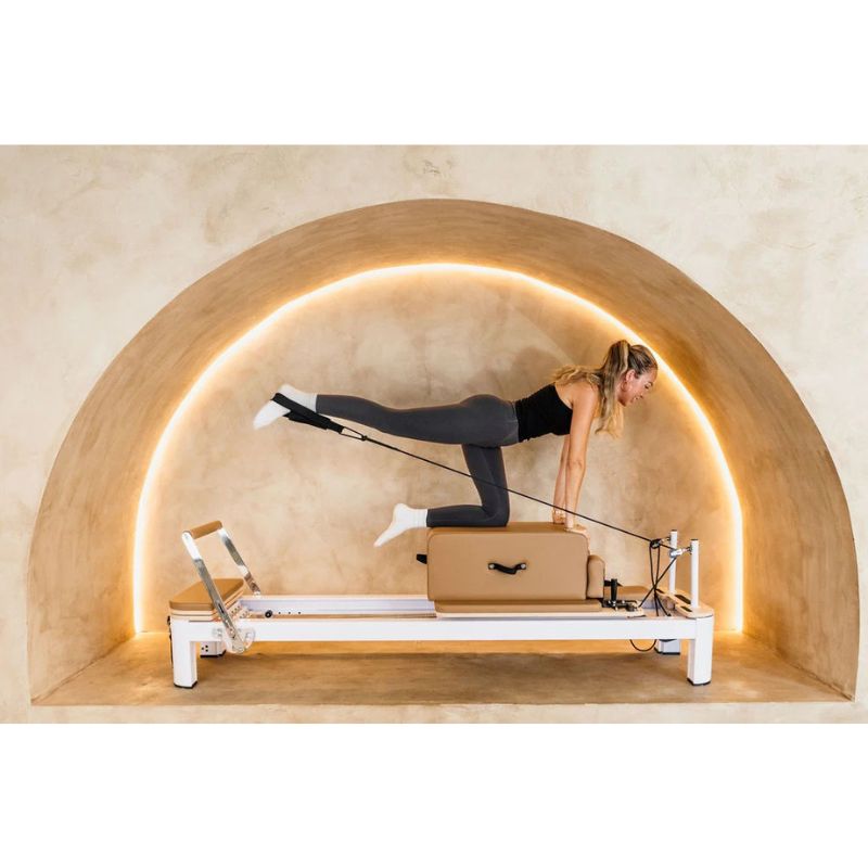 AussiePilatesDefineAP-AL-22ReformerInCaramelColourwithFemaleUsingItAnotherLook