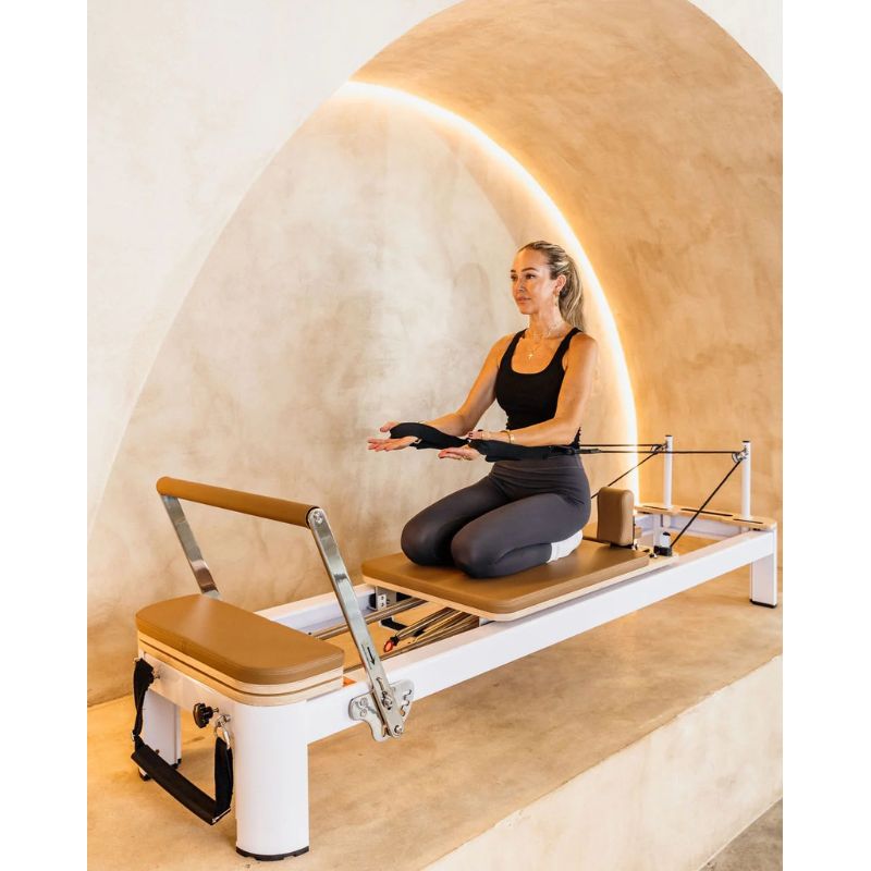 AussiePilatesDefineAP-AL-22ReformerInCaramelColourwithFemaleUsingIt