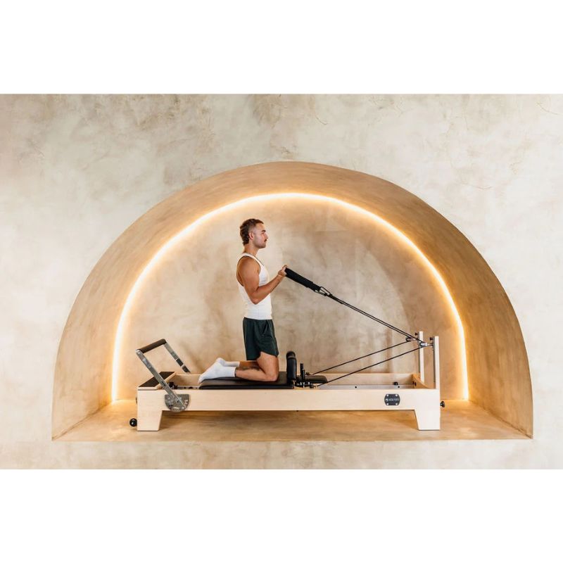 AussiePilatesLuxeStudioReformerAP-03InBlackColourAnotherLookWhenPersonUsingIt