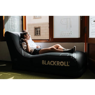 BLACKROLL Portable Inflatable Air Lounger 2.0 with female using it while resting