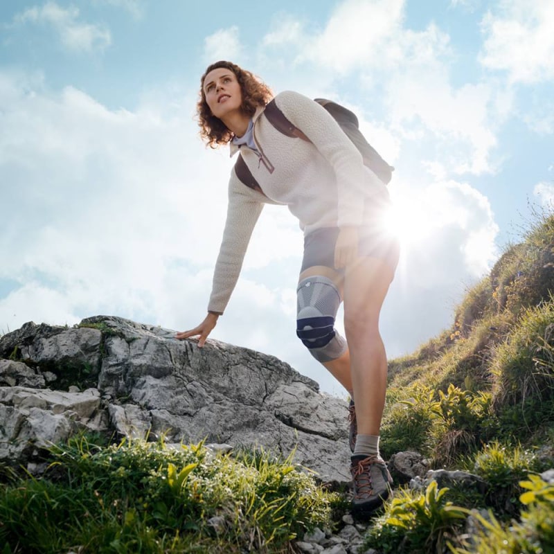 Bauefeind Genutrain Knee Brace worn by a woman hiking