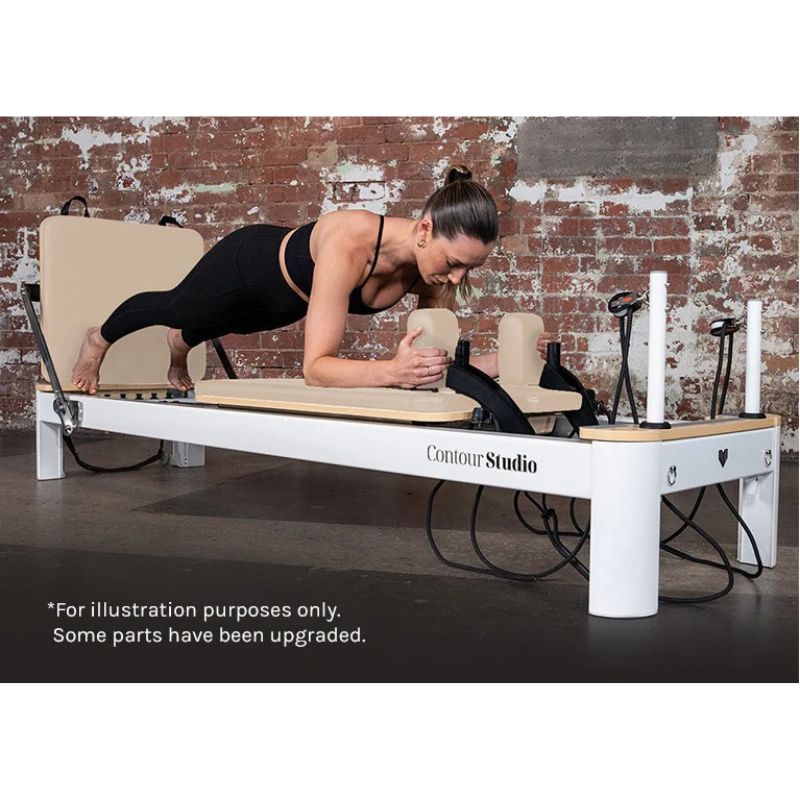 Contour Studio Commercial Pilates Reformer Machine in Beige Colour with Woman Using it while Planking