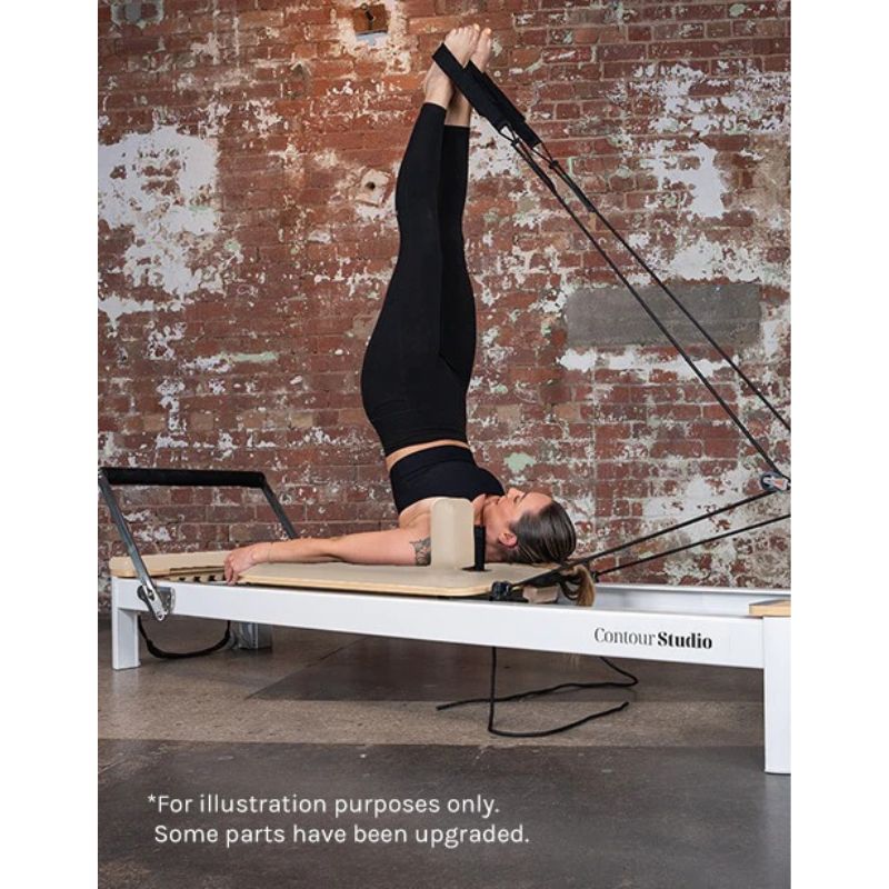 Contour Studio Commercial Pilates Reformer Machine in Beige Colour with Woman Using the rope