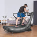 Lifespan Fitness Corsair FreeRun 105 Curved Treadmill With Man Starting To Run and Holding the Safety Handle