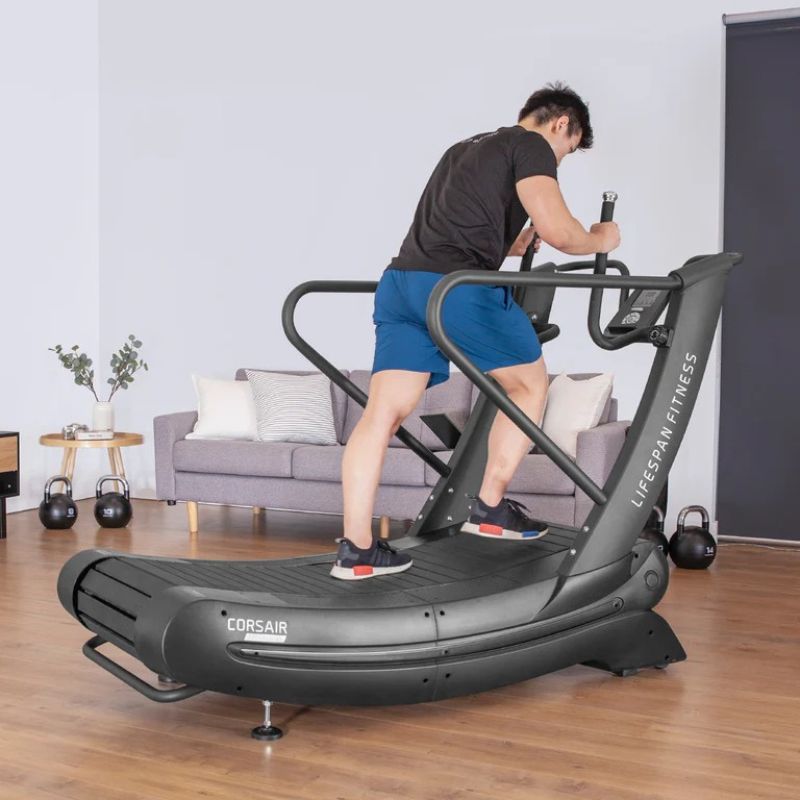 Lifespan Fitness Corsair FreeRun 105 Curved Treadmill With Man Starting To Run and Holding the Safety Handle