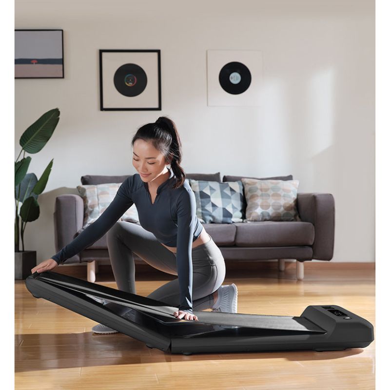 Lifespan Fitness WalkingPad™ M2 Treadmill with Female Folding It Slowly