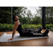 NERV Squeeze Heated Compression Boots with Man Using It While Sitting