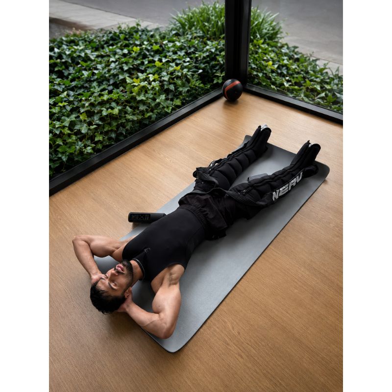 NERV Squeeze Compression Boots with man using it while lying down
