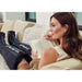 Therabody Jet Boots Used By Woman While Reading