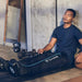 Therabody Jet Boots With Man Inside Gym Using It